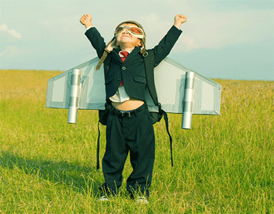 A child dressed up like an airplane